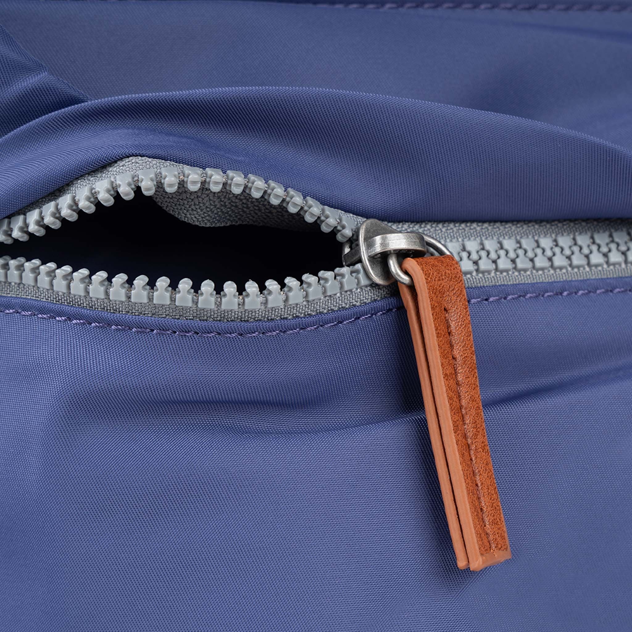 Roka Kennington B Crossbody Recycled Nylon Indigo, zip detail.