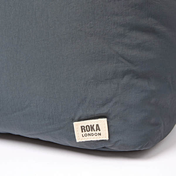 Roka Oxford Raven Recycled Taslon Shoulder Bag, brand label detail.