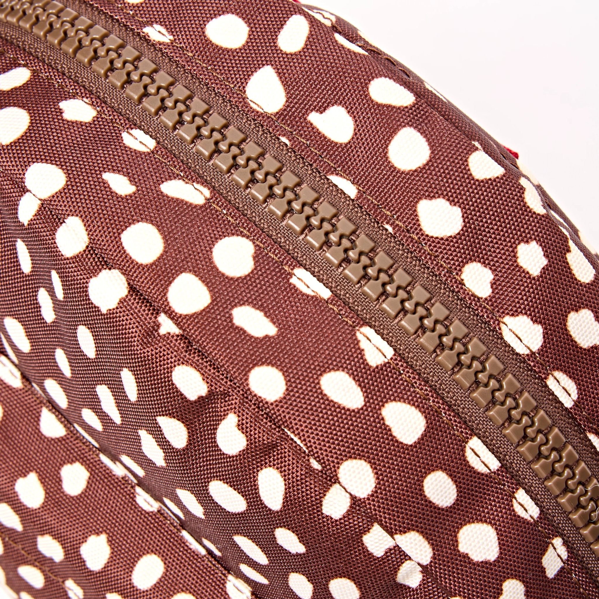 Roka Paddington Brown Dot Recycled Canvas Crossbody Bag, zip detail.
