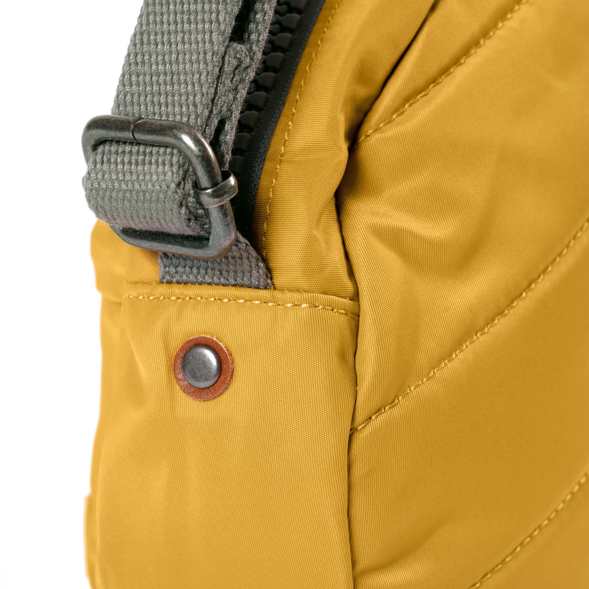 Roka Paddington Corn Recycled Nylon Crossbody Bag, hardware detail.
