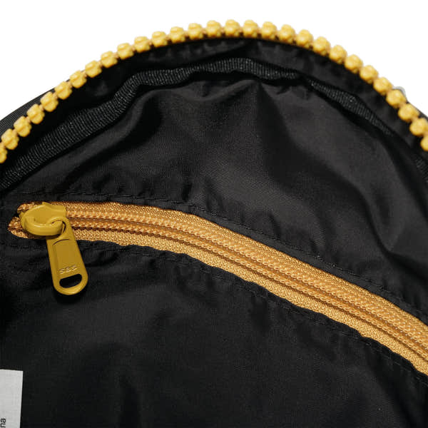 Roka Paddington Corn Recycled Nylon Crossbody Bag, side view.