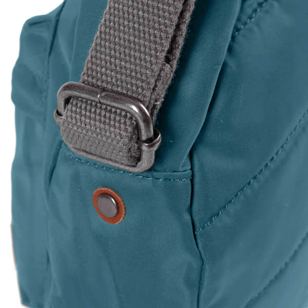 Roka Paddington Teal Recycled Nylon Crossbody Bag, hardware detail.