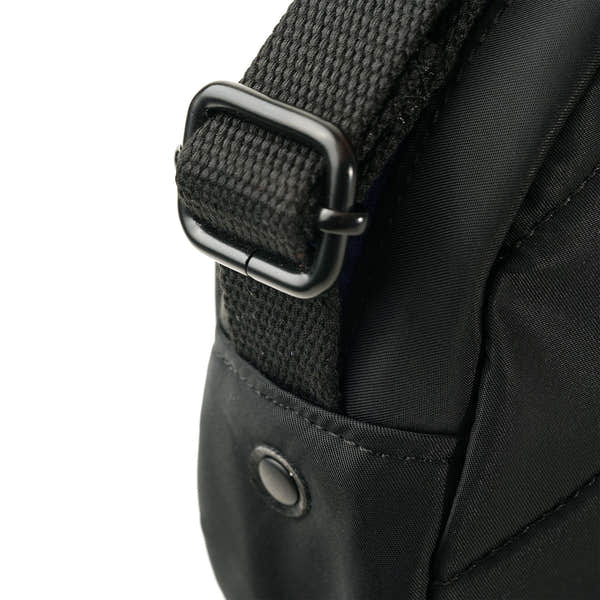 Roka Paddington Teal Recycled Nylon Crossbody Bag, strap detail.