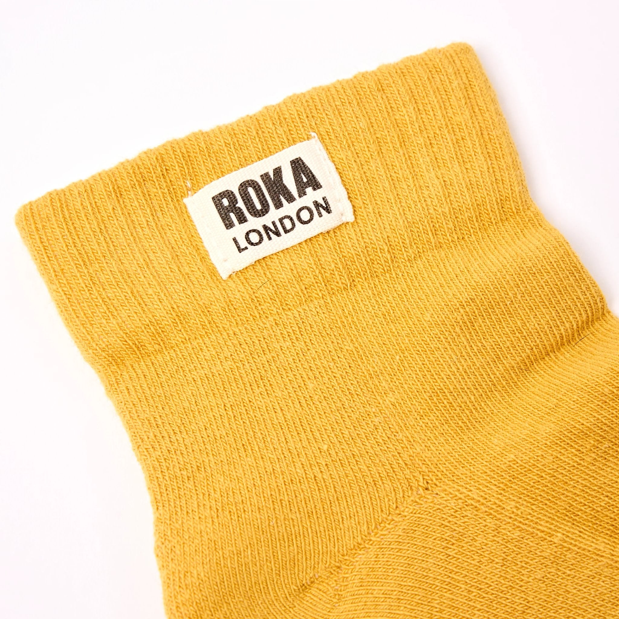 Roka Wembley Mens Corn Organic Cotton One Size, brand label detail.