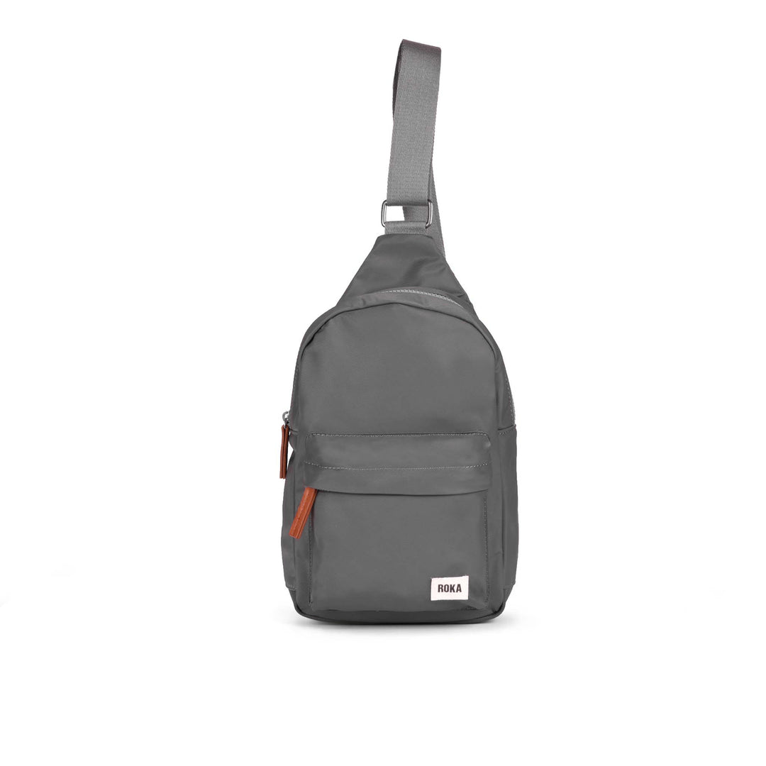 Roka Willesden Graphite Recycled Nylon Sling Bag, front view.