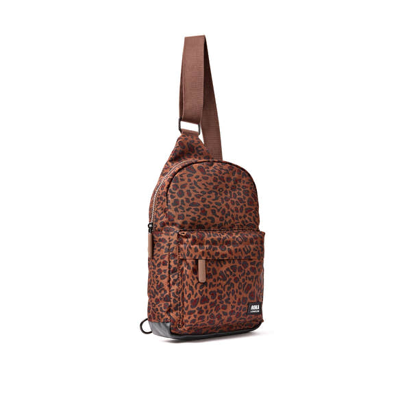 Roka Willesden Mini Leopard Recycled Canvas Sling Bag, side view.