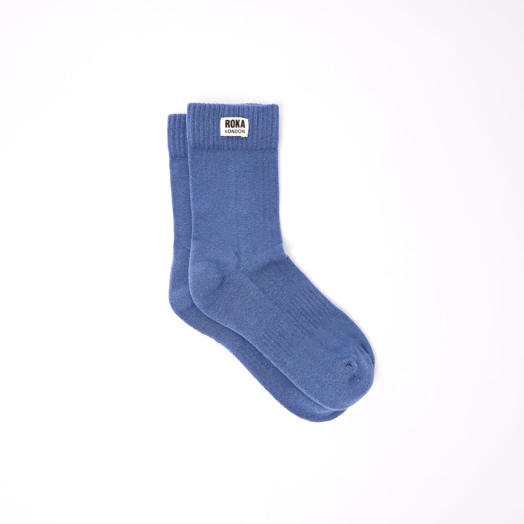 Roka Wimbledon Ladies Cotton Crew Sock One Size Coastal Blue, flat lay view.