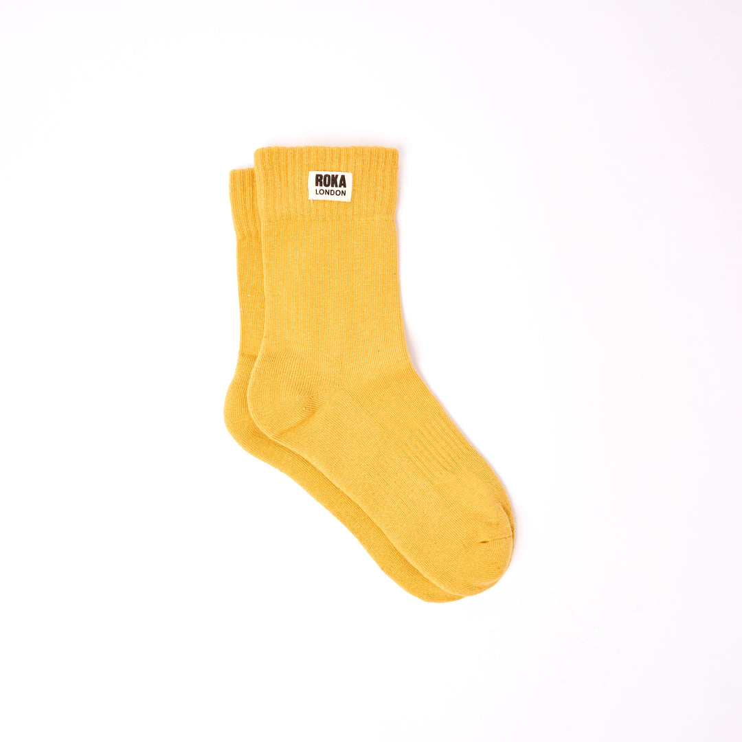 Roka Wimbledon Ladies Cotton Crew Sock One Size Corn, flat lay view.