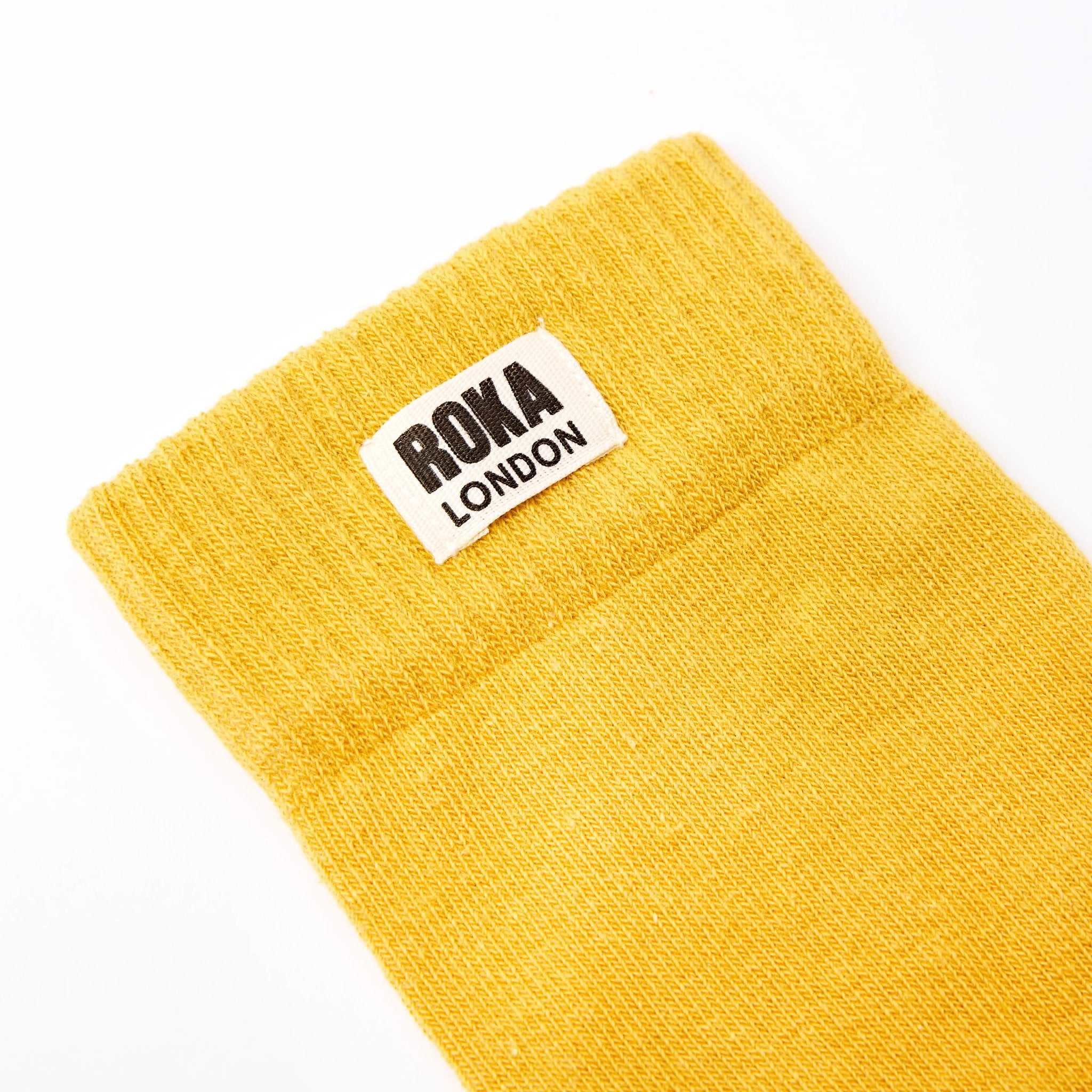 Roka Wimbledon Ladies Cotton Crew Sock One Size Corn, brand label detail.