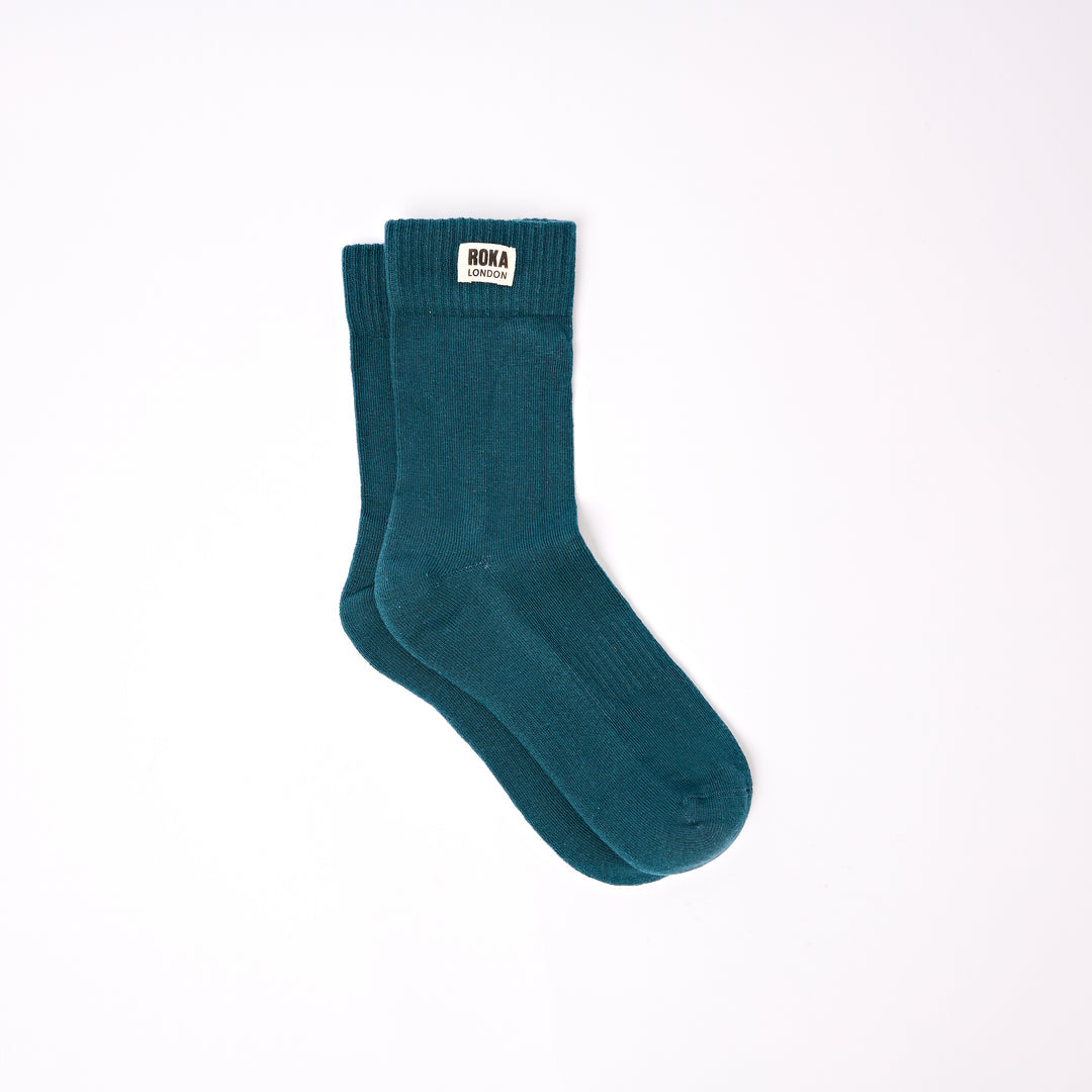 Roka Wimbledon Ladies Cotton Crew Sock One Size Teal, flat lay view.