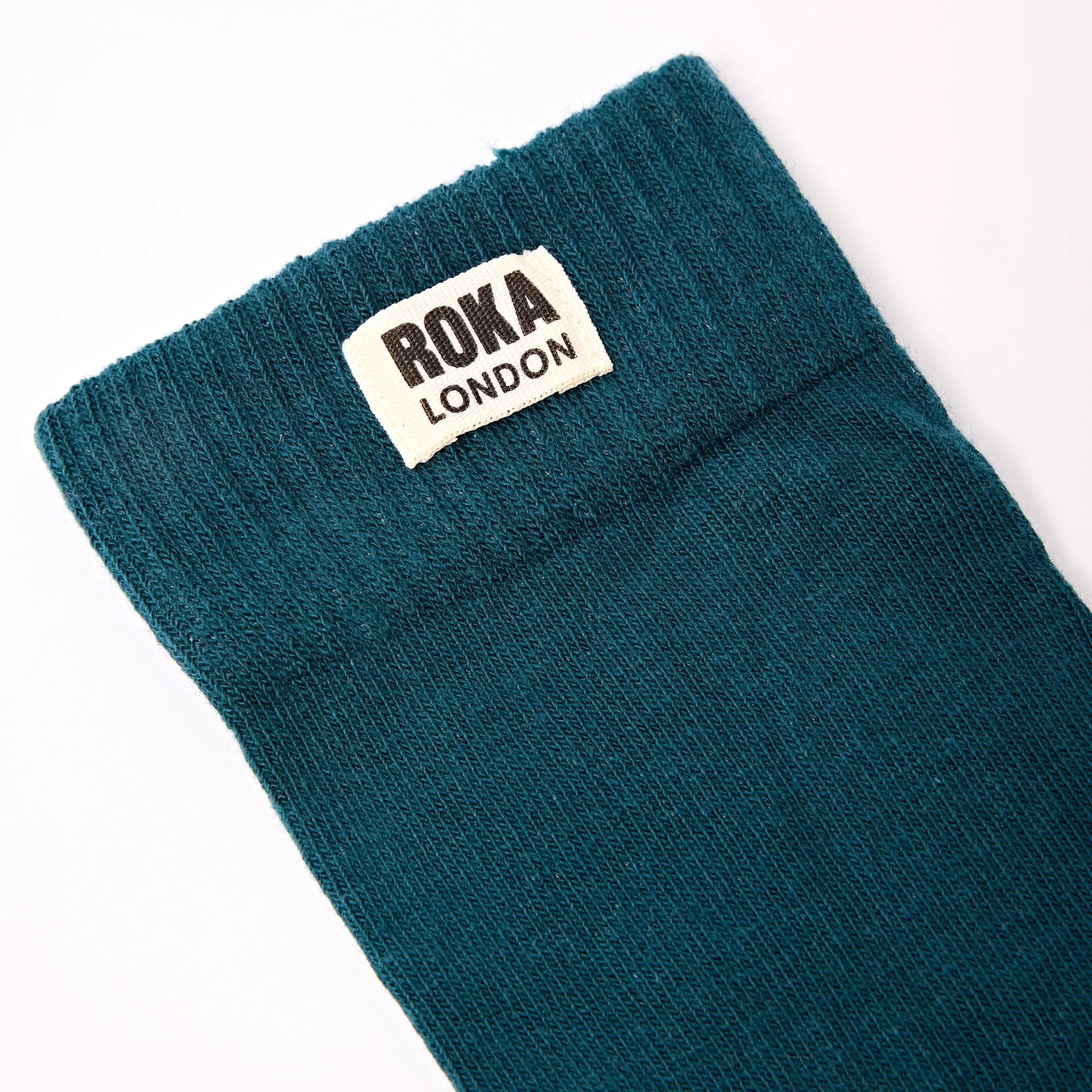 Roka Wimbledon Ladies Cotton Crew Sock One Size Teal, brand label detail.