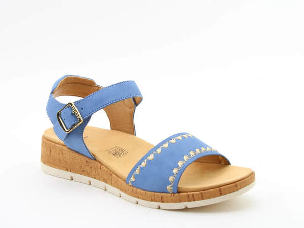 Heavenly Feet Lacie women's blue textile vegan buckle sandals with cork wedge heel and white sole.