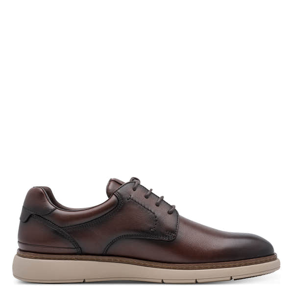 Inner side of the mocca brown Tamaris lace-up shoe showing the lace fastening and low heel.