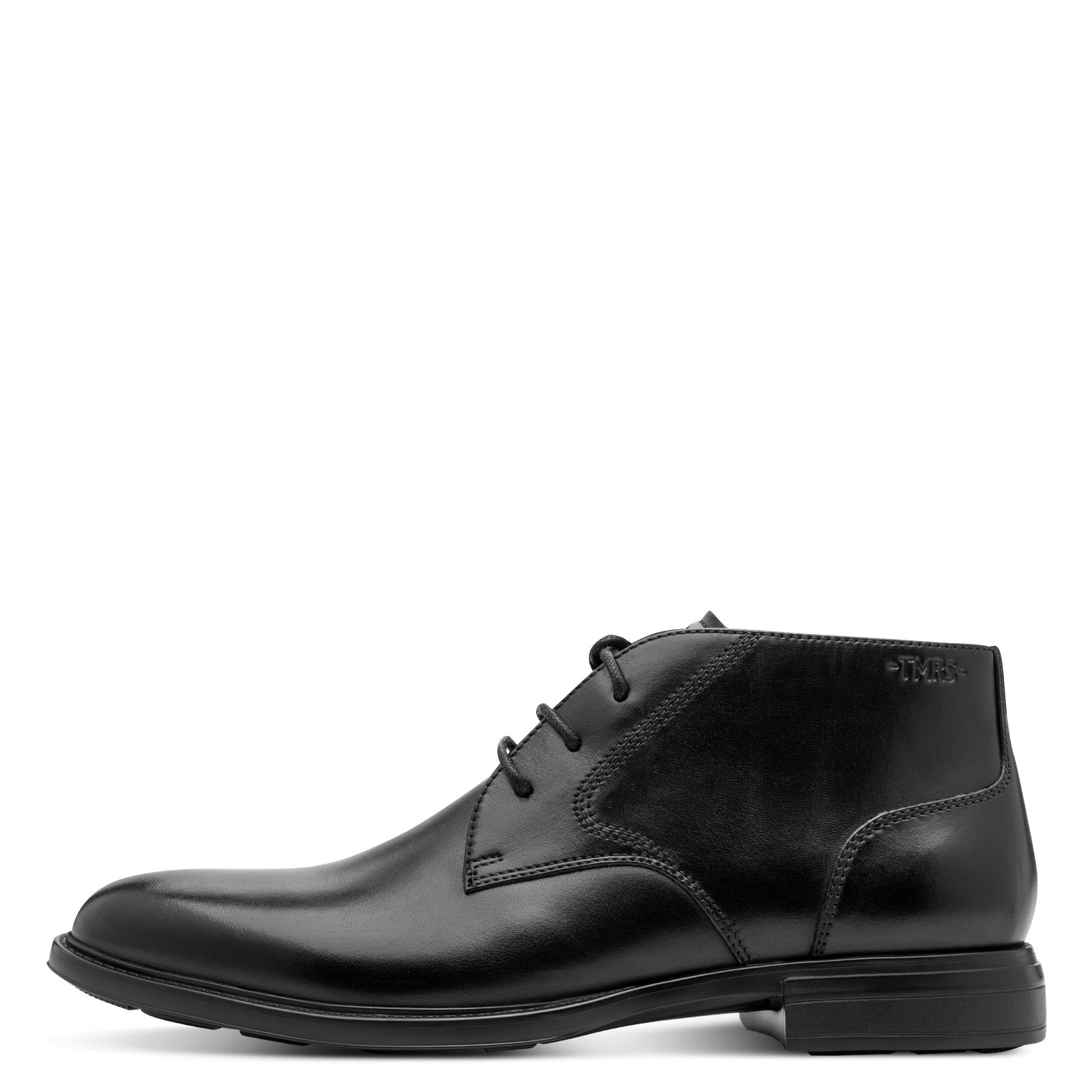 Outer side of the black Tamaris chukka boot showing the leather panels, stitching and sole.