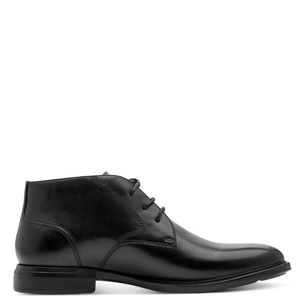 Inner side of the black Tamaris chukka boot showing the lace fastening and ankle collar.