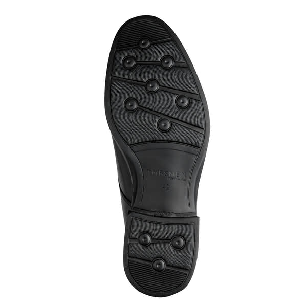 Underside of the black Tamaris chukka boot showing the sole and tread pattern.