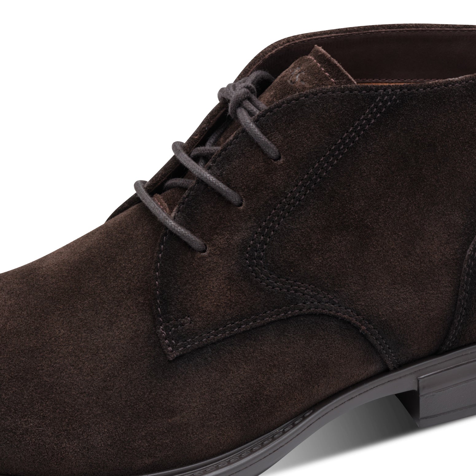 Close-up of the brown suede Tamaris chukka boot showing the suede texture, stitching and lace eyelets.