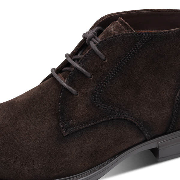 Close-up of the brown suede Tamaris chukka boot showing the suede texture, stitching and lace eyelets.