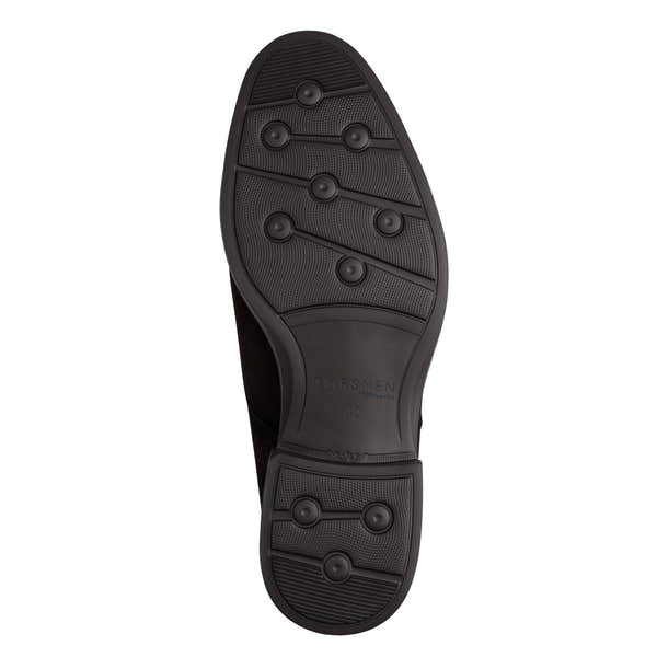 Underside of the brown suede Tamaris chukka boot showing the sole and tread pattern.