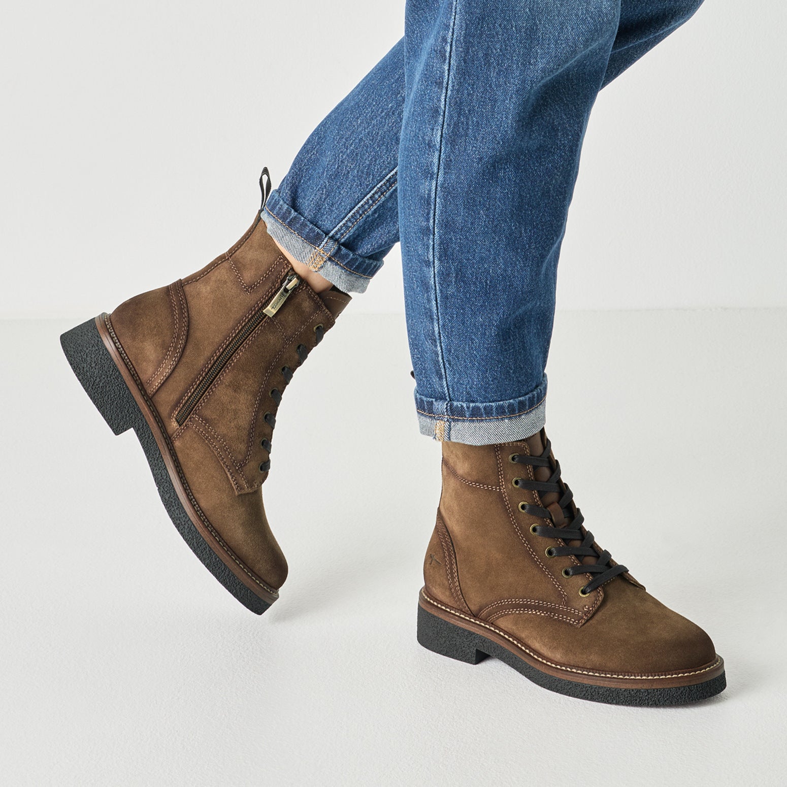 Camel tamaris zip and lace ankle boot worn on foot, side view.