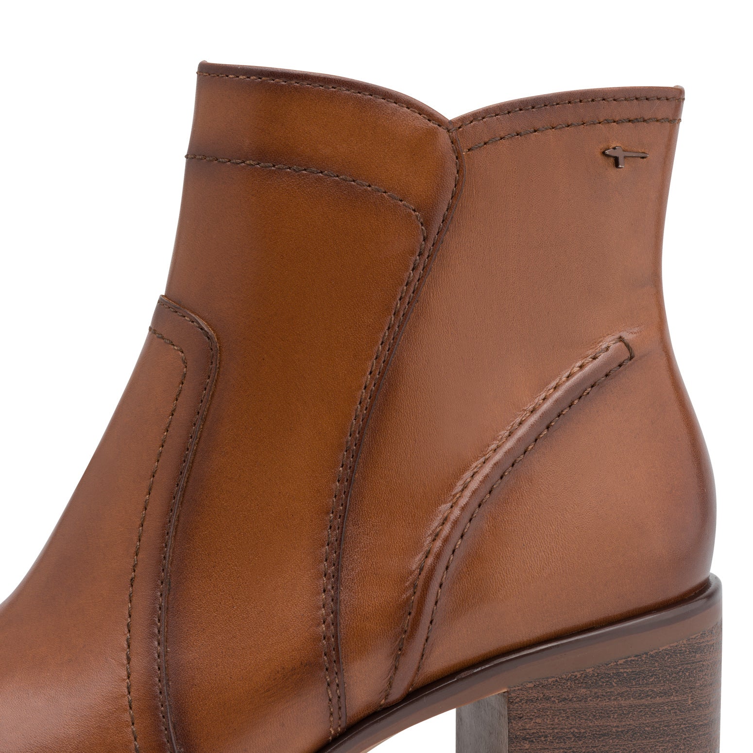 Close-up of the cognac Tamaris ankle boot showing the leather panels, stitching, Tamaris trim and block heel.