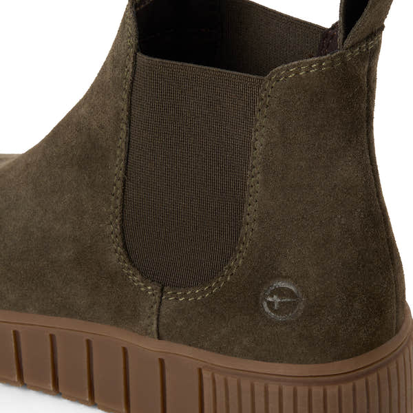 Close-up of the olive suede Tamaris Chelsea boot showing the suede texture, stitching and elastic side panel.