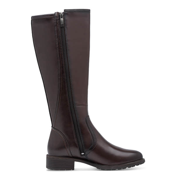 Inner side of the mahogany brown Tamaris knee-high boot showing the side zip, tall shaft and heel.