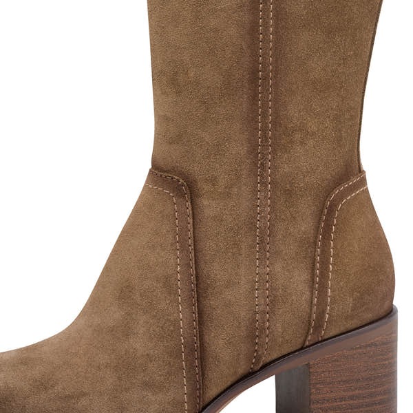Close-up of the camel suede Tamaris knee-high boot showing the suede leather panels, stitching and block heel.