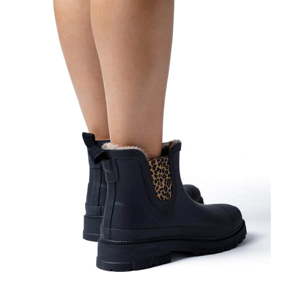Verbenas Lua Fur Lined women's Black Waterproof Chelsea Boots with Leopard Print Gusset, worn on foot, rear view.