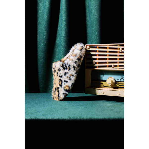 Verbenas York Feline women's leopard-print open-back slipper displayed beside a vintage radio.