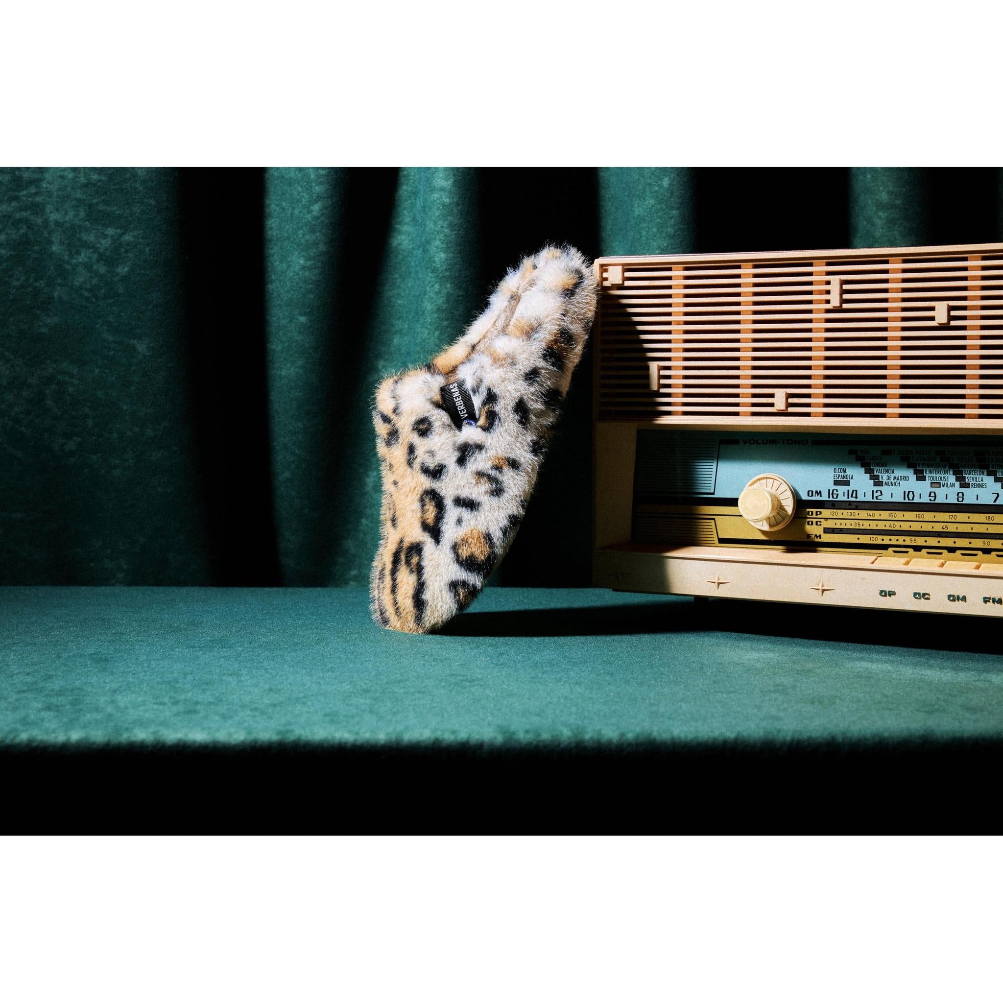 Verbenas York Feline women's leopard-print open-back slipper in a landscape product lifestyle image.