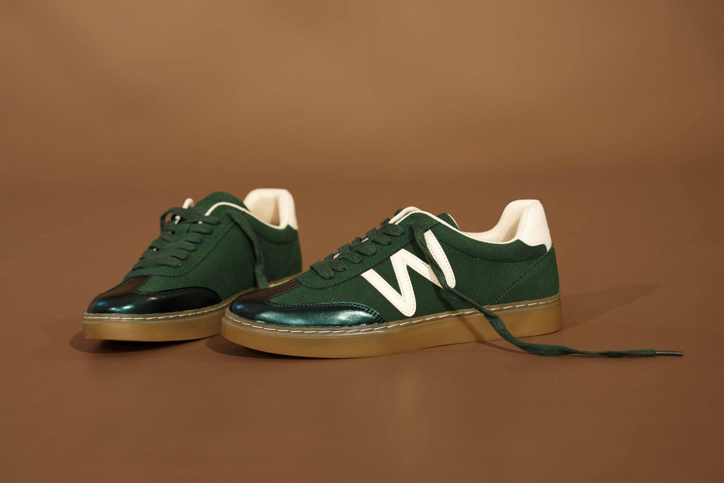 Westland Kira 01 women's green combi vegan lace-up trainers worn on foot, Westland lifestyle view 7.