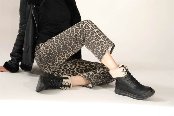 Westland Peyton 16 women's black vegan waterproof zip-and-lace faux fur ankle boots worn on foot, Westland lifestyle view 3.