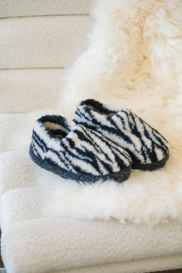 Yoko 2428 Zebra Print unisex wool slippers in black and white, lifestyle view.